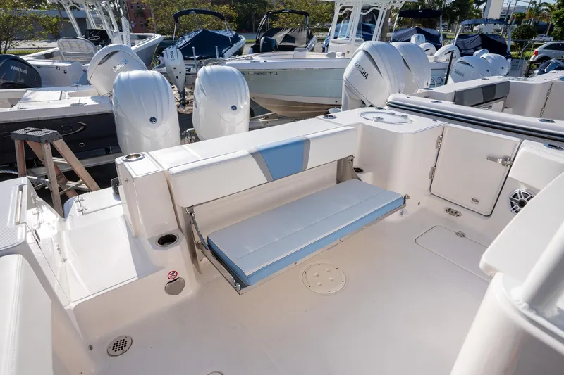 Slide: The Image of 2025 Robalo R270 boat interior with foldable seating and modern design. - 17