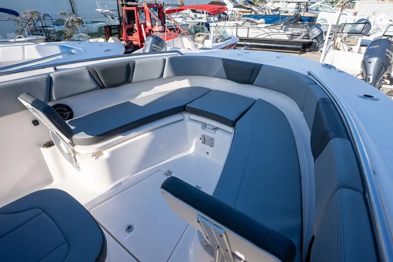 Slide: The Image of 2025 Robalo R270 boat interior with spacious seating and modern design. - 13