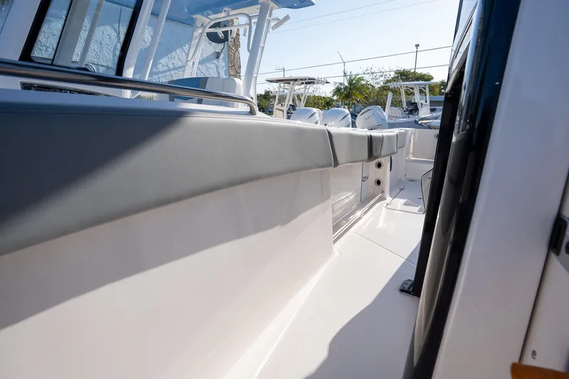 Slide: The Image of 2025 Robalo R270 boat interior with sleek seating and modern design. - 14