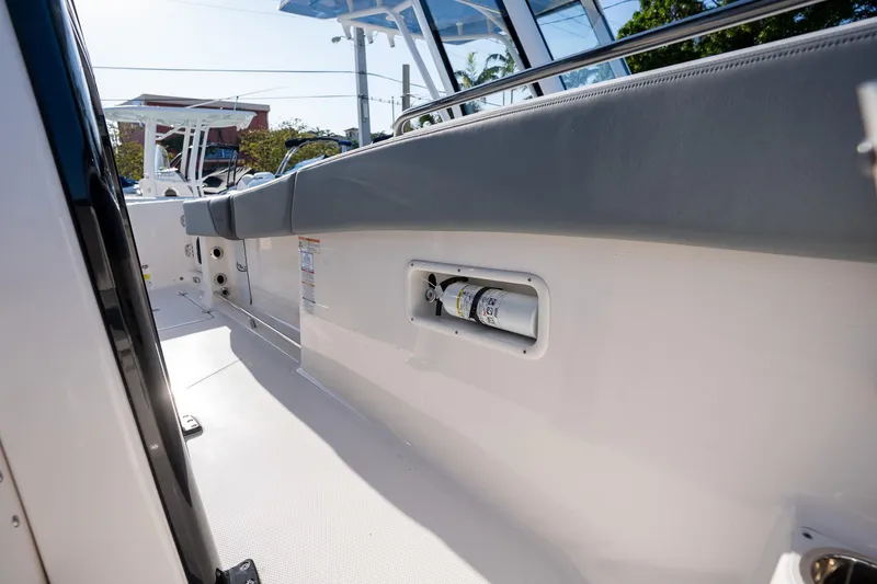 Slide: The Image of 2025 Robalo R270 boat interior with sleek seating and modern design features. - 15