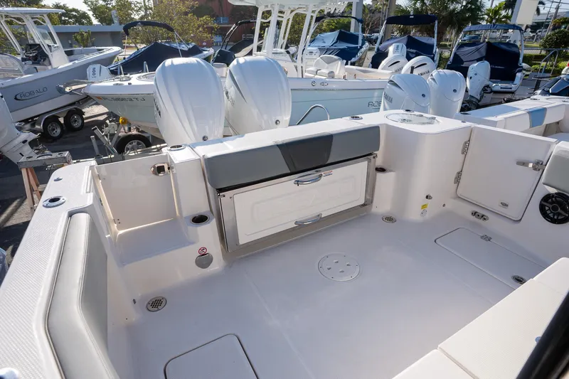 Slide: The Image of 2025 Robalo R270 boat interior with dual engines and spacious deck layout. - 18