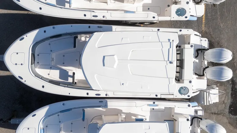 Slide: The Image of 2025 Robalo R270 boat, aerial view, showcasing sleek design and twin engines. - 20