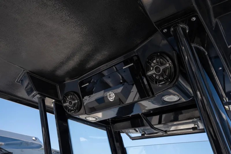 Slide: The Image of 2025 Robalo R270 boat interior ceiling with speakers and sleek design. - 8