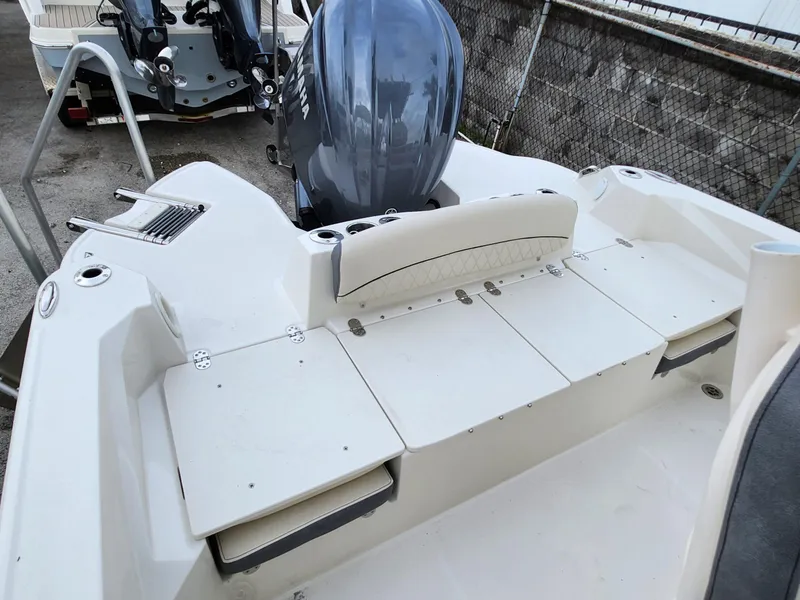 Slide: The Image of 2023 Stingray 236CC boat with Yamaha outboard motor, featuring a spacious rear deck. - 15