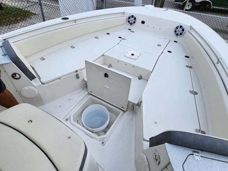 Slide: The Image of 2023 Stingray 236CC boat interior with seating and storage compartments. - 17