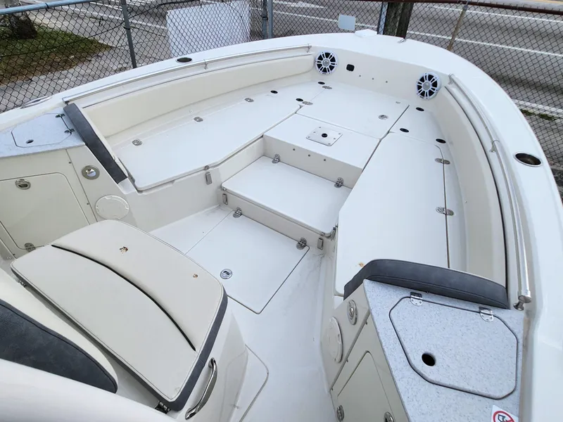 Slide: The Image of 2023 Stingray 236CC boat interior with seating and storage compartments. - 21