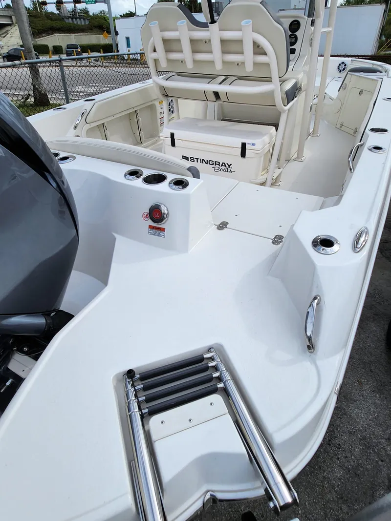 Slide: The Image of 2023 Stingray 236CC boat interior with seating and ladder, showcasing modern design features. - 24