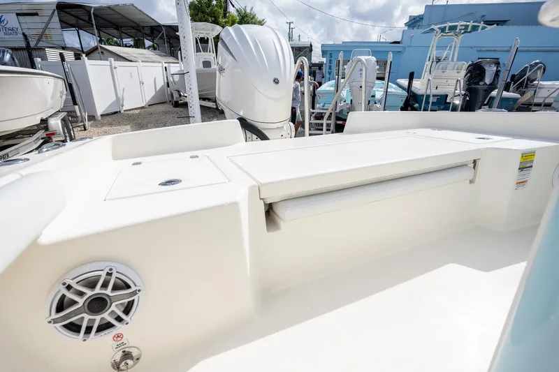 Slide: The Image of 2025 Pathfinder 2400 TRS boat interior with speaker and storage compartment. - 13