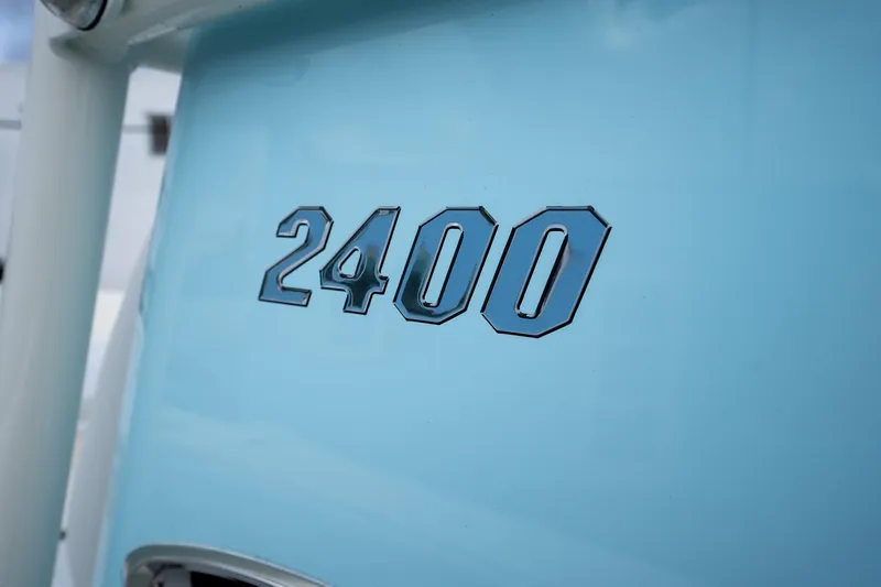 Slide: The Image of Pathfinder 2400 TRS 2025 model emblem on light blue surface. - 17