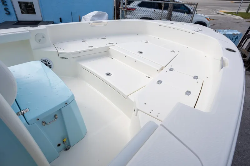 Slide: The Image of 2025 Pathfinder 2400 TRS boat interior with storage compartments and seating. - 8