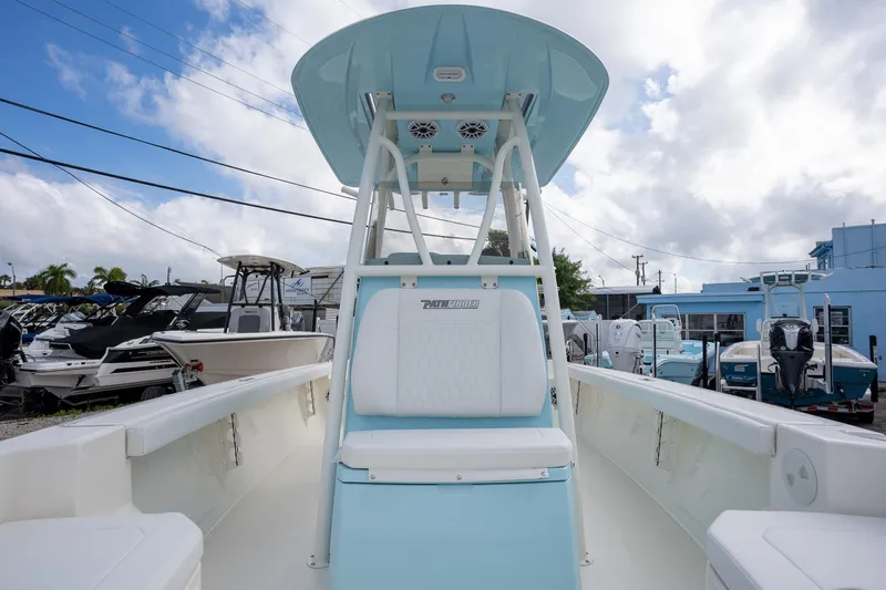 Slide: The Image of 2025 Pathfinder 2400 TRS boat interior with seating and console, displayed outdoors. - 9