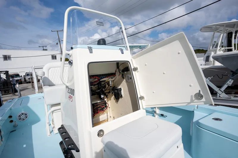 Slide: The Image of 2025 Pathfinder 2300 HPS boat with open console, showcasing interior wiring and components. - 14