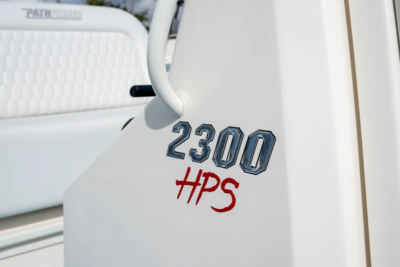 Slide: The Image of 2025 Pathfinder 2300 HPS boat logo on white surface. - 9