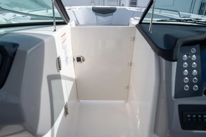 Slide: The Image of 2025 Robalo R317 boat interior, featuring sleek dashboard and modern controls. - 17