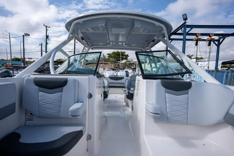 Slide: The Image of 2025 Robalo R317 boat interior with modern seating and sleek design. - 6