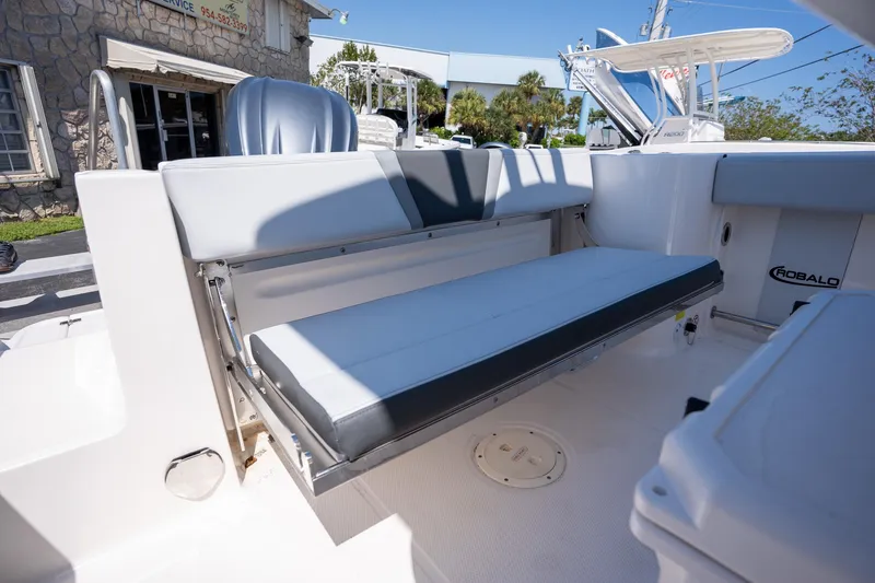 Slide: The Image of 2025 Robalo R230 boat interior with foldable seating and sleek design. - 13