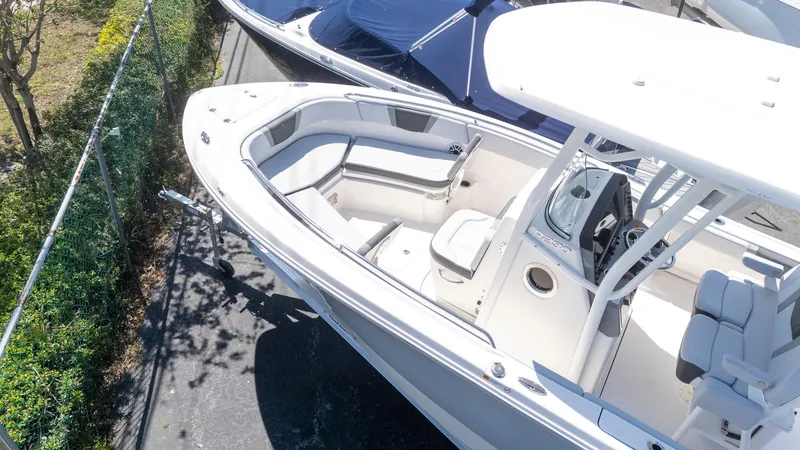 Slide: The Image of 2025 Robalo R230 boat with spacious seating and modern console design. - 5