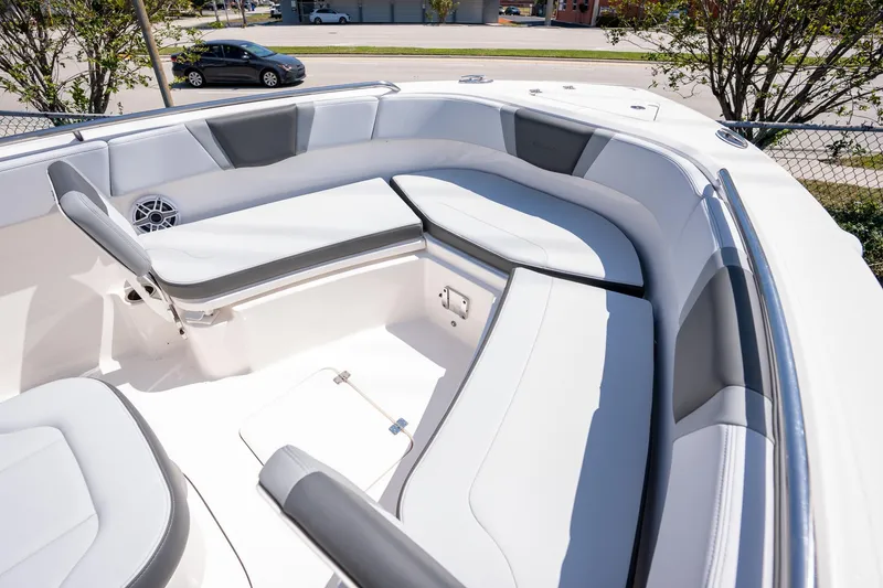 Slide: The Image of 2025 Robalo R230 boat interior with cushioned seating and storage compartments. - 7