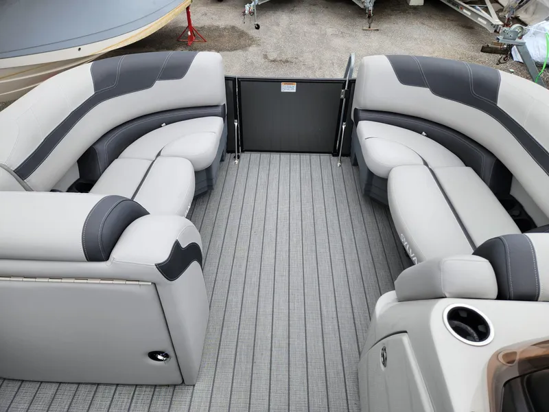 Slide: The Image of 2024 Sylvan L3 DLZ Bar boat interior with gray seating and flooring. - 10