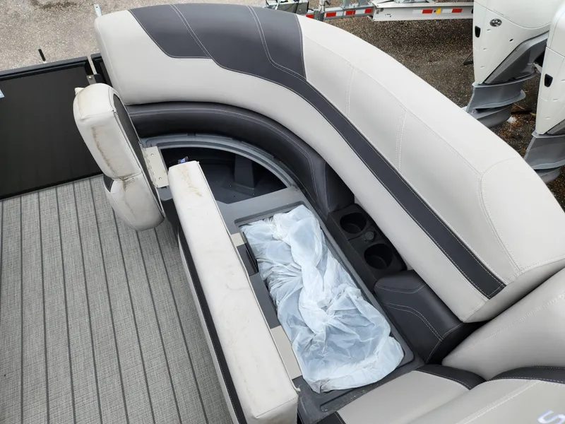 Slide: The Image of 2024 Sylvan L3 DLZ Bar boat seating with storage and cup holders. - 12