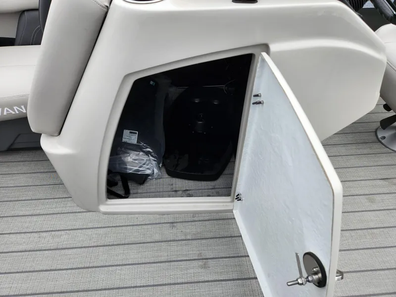 Slide: The Image of Open storage compartment on 2024 Sylvan L3 DLZ Bar boat, featuring sleek interior design. - 13
