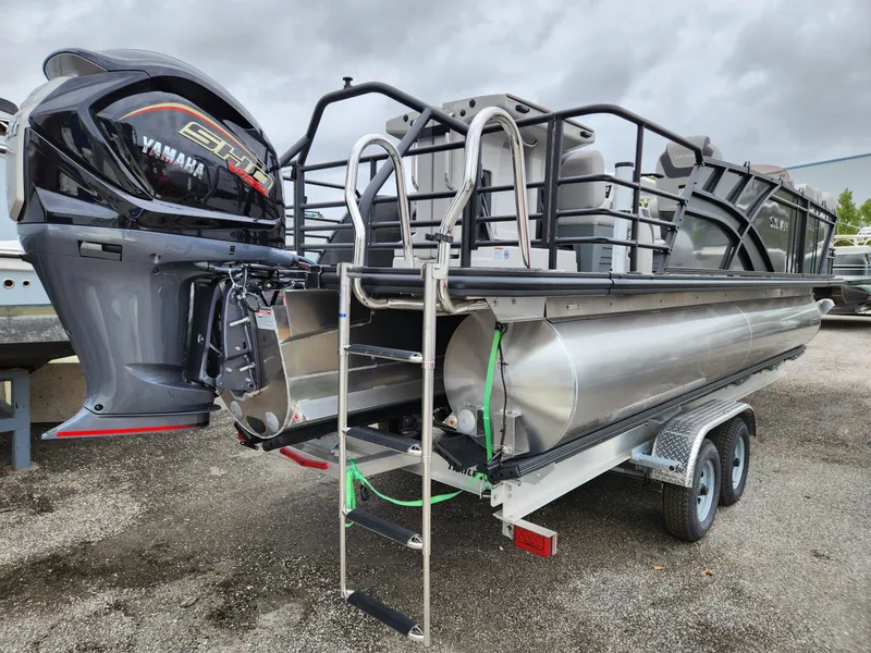Slide: The Image of 2024 Sylvan L3 DLZ Bar pontoon boat with Yamaha engine on trailer. - 3