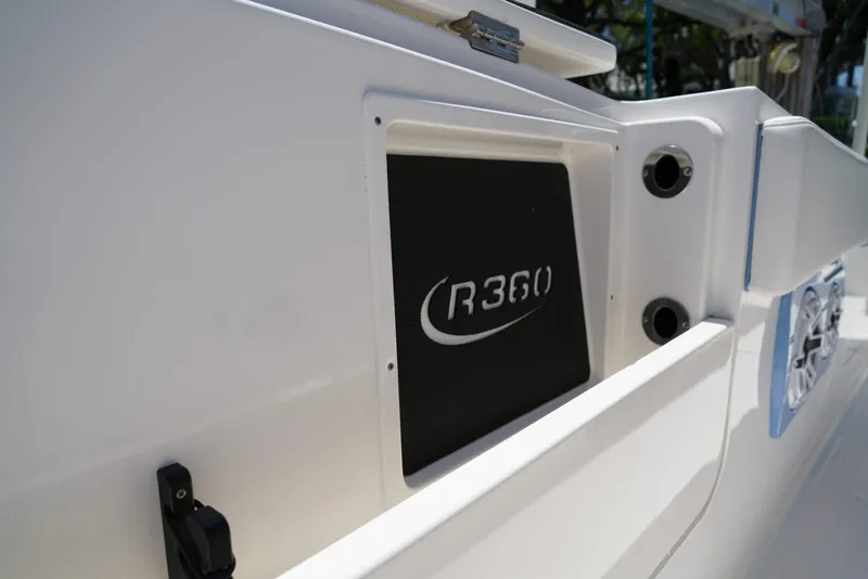 Slide: The Image of 2024 Robalo R360 boat detail with logo and sleek white design. - 23