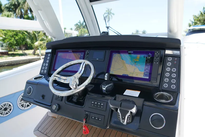 Slide: The Image of 2024 Robalo R360 helm with dual navigation screens and modern controls. - 31