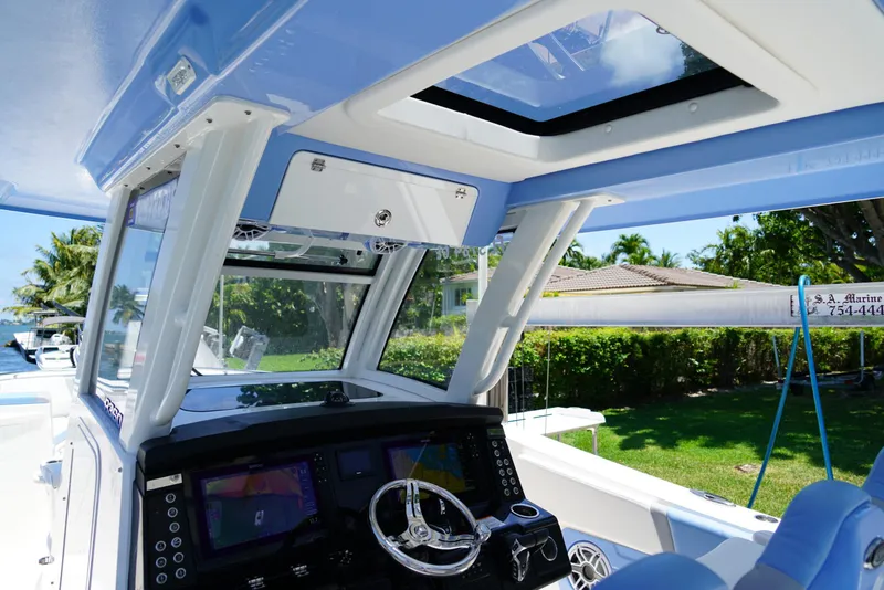 Slide: The Image of 2024 Robalo R360 boat cockpit with advanced navigation system and sleek design. - 41