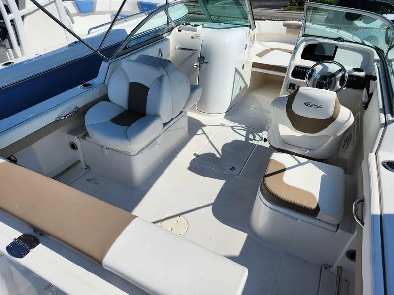 Slide: The Image of 2023 Robalo R227 boat interior with seating and steering wheel. - 11