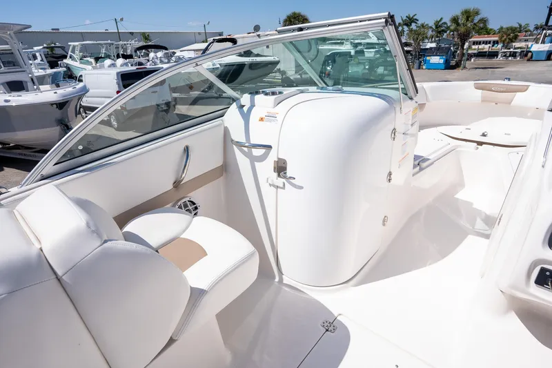 Slide: The Image of 2023 Robalo R227 boat interior with white seating and sleek design. - 15