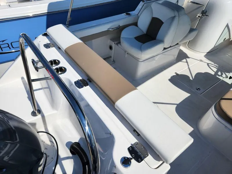 Slide: The Image of 2023 Robalo R227 boat interior with seating and stainless steel railings. - 18
