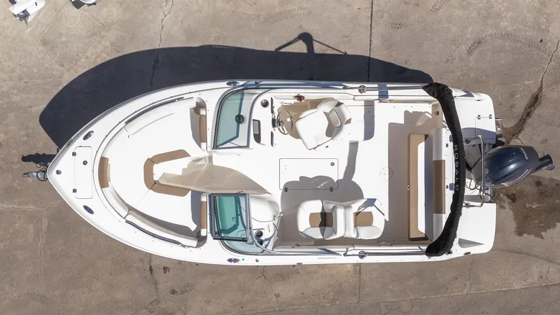 Slide: The Image of 2023 Robalo R227 boat, aerial view, showcasing spacious seating and sleek design. - 26
