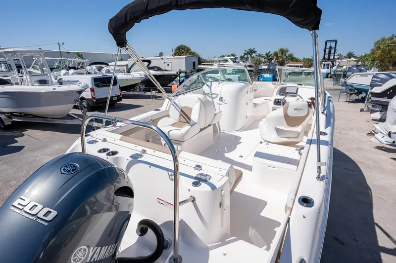 Slide: The Image of 2023 Robalo R227 boat with Yamaha 200 engine, displayed in a marina setting. - 30