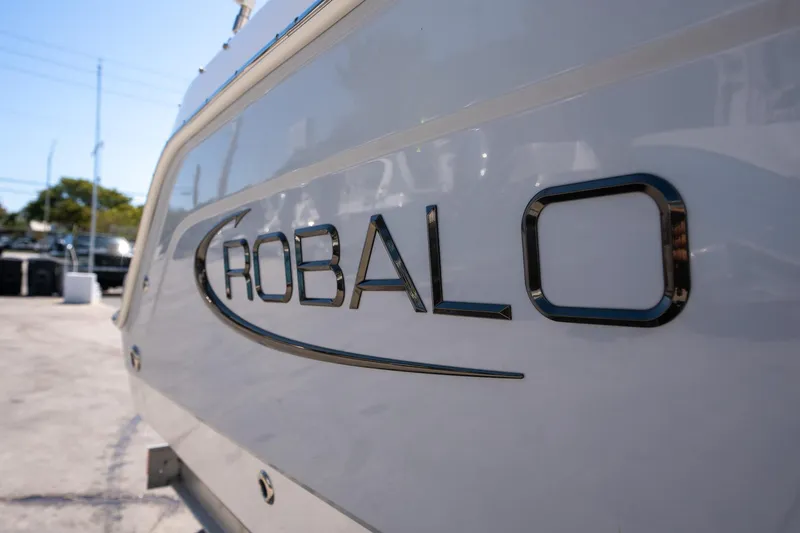 Slide: The Image of 2023 Robalo R227 boat logo on hull, close-up view. - 5
