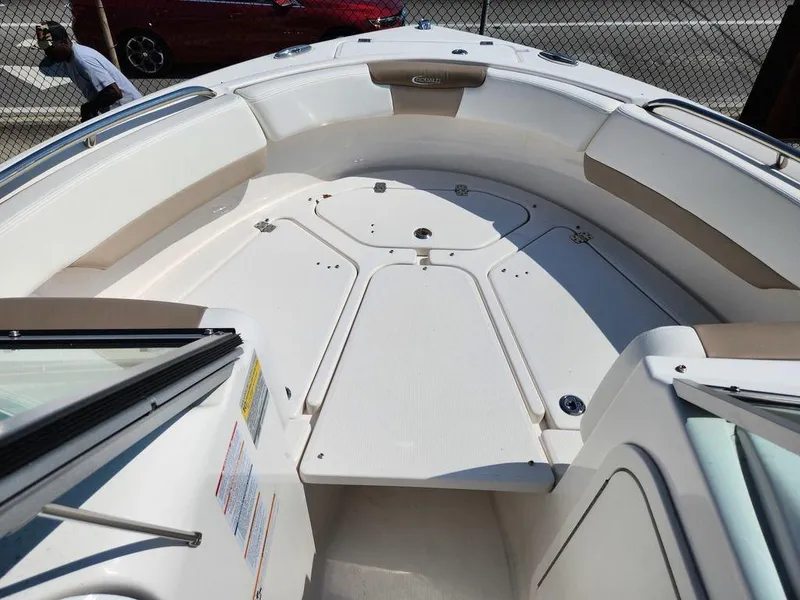 Slide: The Image of 2023 Robalo R227 boat interior with spacious seating and sleek design. - 6