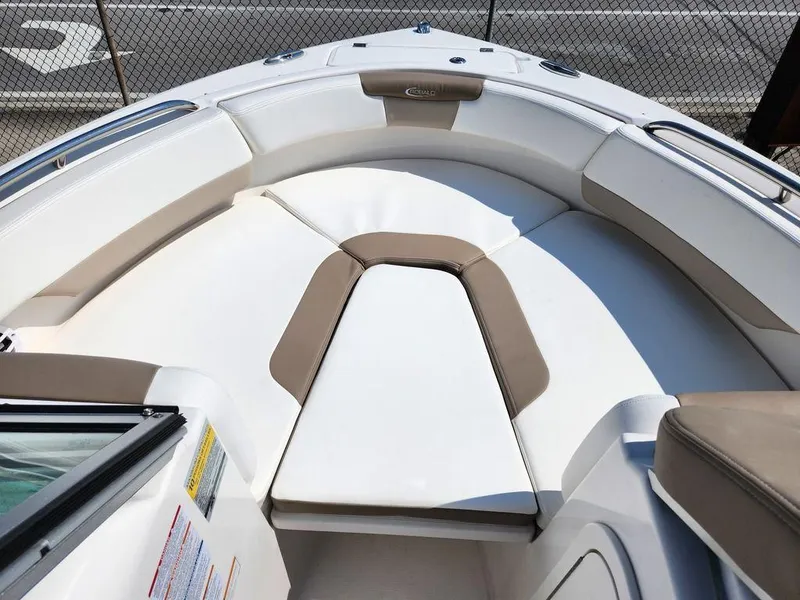 Slide: The Image of 2023 Robalo R227 boat interior with cushioned seating and sleek design. - 7