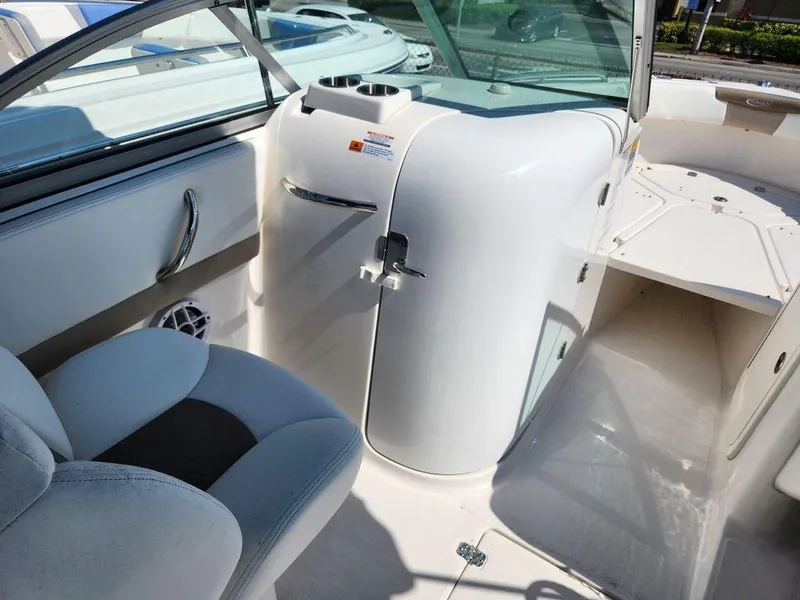 Slide: The Image of 2023 Robalo R227 boat interior with seating and storage compartment. - 9