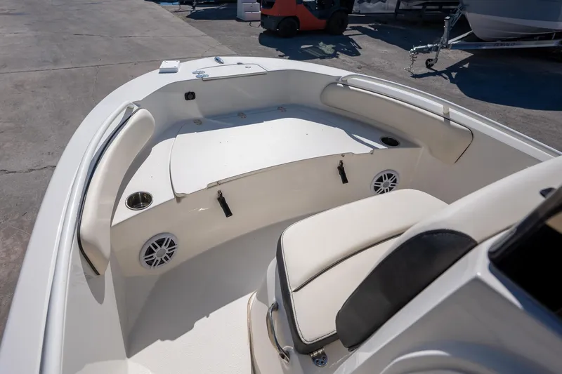 Slide: The Image of 2023 Stingray 173CC boat interior with cushioned seating and cup holders. - 7