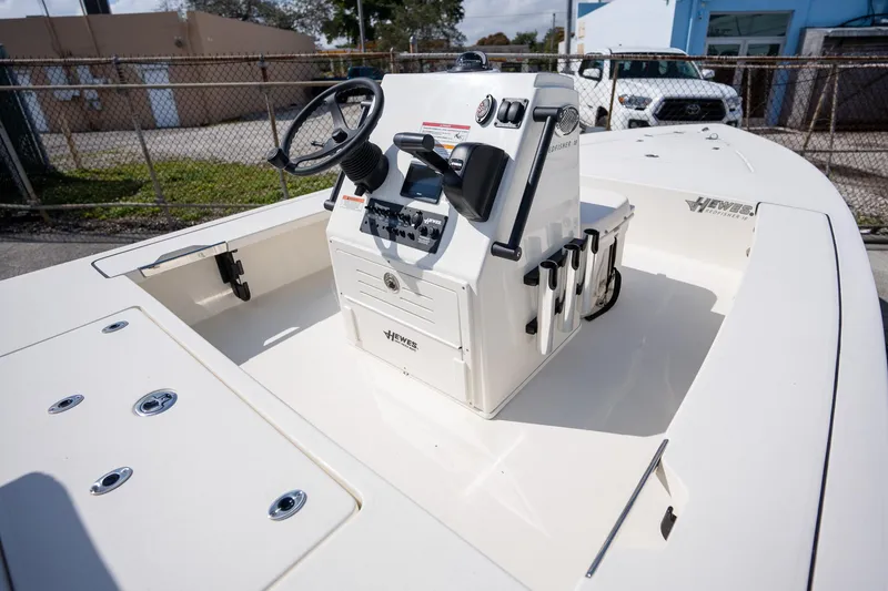 Slide: The Image of 2025 Hewes Redfisher 18 boat, featuring a sleek console and spacious deck. - 3