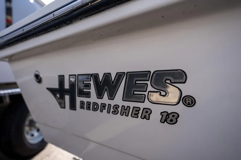 Slide: The Image of 2025 Hewes Redfisher 18 boat logo close-up. - 5