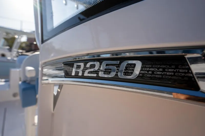Slide: The Image of 2025 Robalo R250 boat emblem close-up in sunlight. - 11