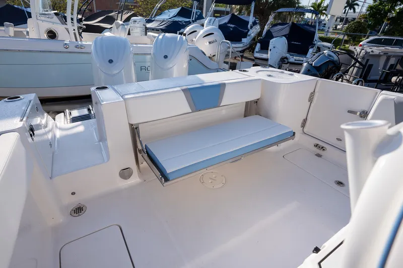 Slide: The Image of 2025 Robalo R250 boat interior with foldable seating and modern design. - 13