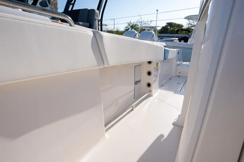 Slide: The Image of 2025 Robalo R250 boat interior, showcasing sleek white seating and modern design features. - 16
