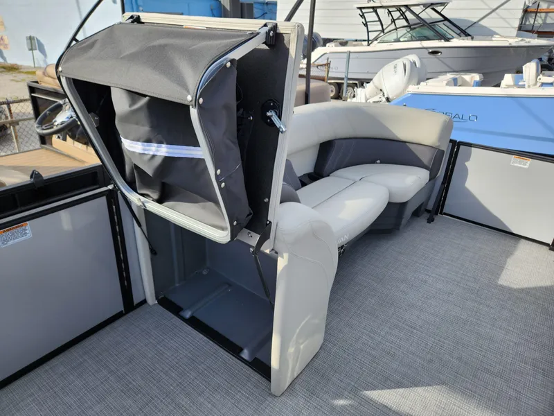 Slide: The Image of 2023 Sylvan X5 boat interior with seating and storage compartment. - 15
