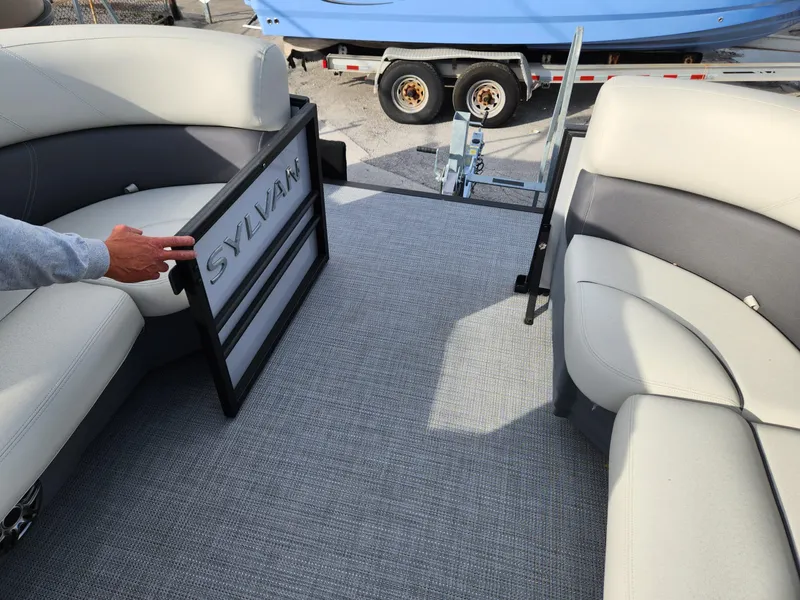 Slide: The Image of 2023 Sylvan X5 boat interior with comfortable seating and open gate. - 20