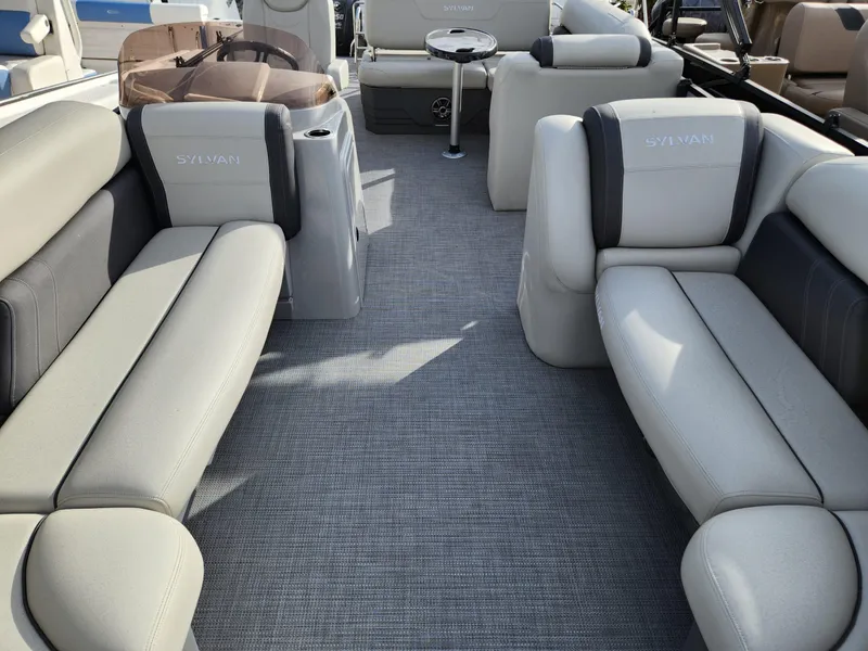 Slide: The Image of 2023 Sylvan X5 boat interior with plush seating and modern design. - 21