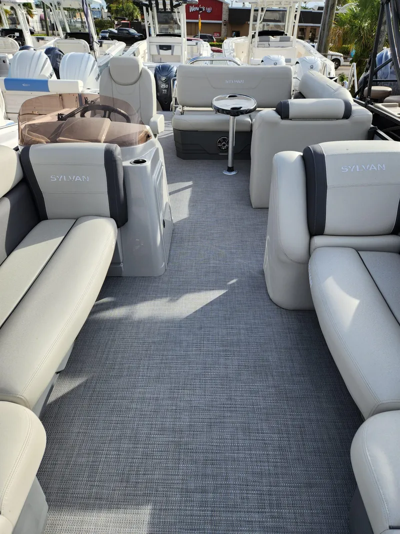 Slide: The Image of 2023 Sylvan X5 boat interior with plush seating and modern design. - 22