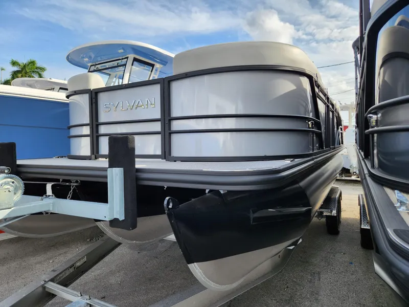 Slide: The Image of 2023 Sylvan X5 pontoon boat on trailer, showcasing sleek design and modern features. - 5