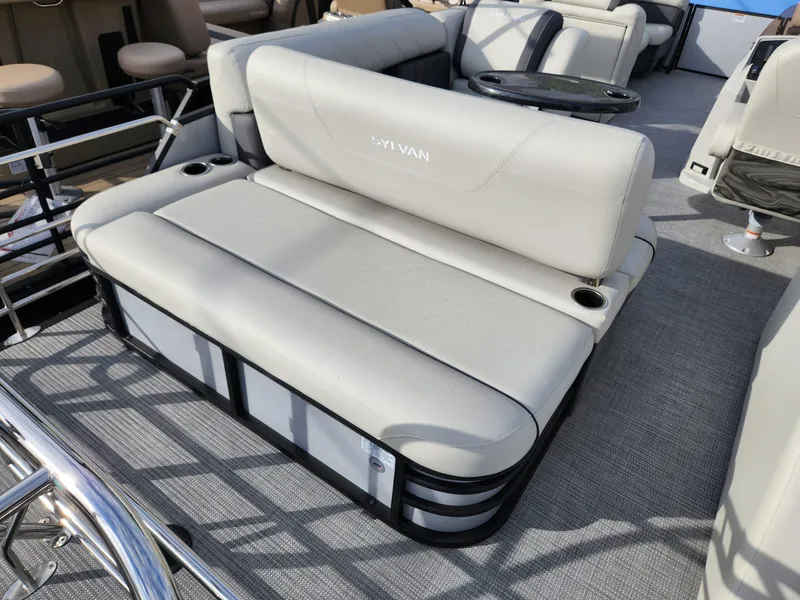 Slide: The Image of 2023 Sylvan X5 boat interior with plush seating and cup holders. - 8